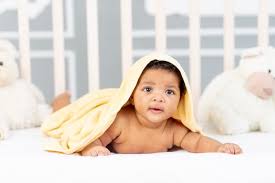 Product title the first years sure comfort newborn to toddler baby bath tub infant bath tub average rating: Premium Photo An African Baby In A White Coat After A Bath And Bathing Plays With A Duck At Home The Concept Of Care And Hygiene Of Young Children