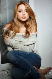 This cut is great for women. Beautiful Long Haired Girl Sitting On A Window Sill Stock Photo Picture And Royalty Free Image Image 11173909