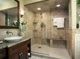 The brass mirror really stands out against the gray wallpaper while the two brown nickel and glass wall sconces tie it all together. Sophisticated Bathroom Designs Hgtv Bathroom Shower Stalls Sophisticated Bathroom Latest Bathroom Designs