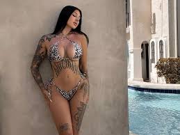 Model branded most beautiful woman ever as she slips into underboob-baring  bikini - Daily Star