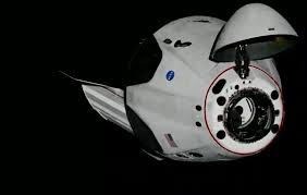 SpaceX's first crewed spacecraft successfully docks with the ...