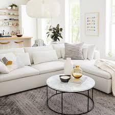 Modern sectional sofas require a matching coffee table to welcome the guests. Streamline Round Coffee Table Marble Corner Sofa With Ottoman West Elm Living Room Living Room Sofa