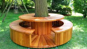 A bench is a long seat on which multiple people may sit at the same time. Wrap Around Tree Bench Wrapping Wooden Tree Table Backyard Landscaping Designs Backyard Backyard Patio Designs