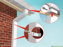 Place the level vertically against the downspout and ensure it is perpendicular. How To Install Rain Gutters With Pictures Wikihow