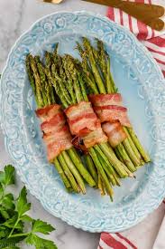 This Bacon Wrapped Asparagus Recipe Is Made So Perfectly Easy In The Oven W Bacon Wrapped Asparagus Bacon Wrapped Asparagus Recipes Asparagus Recipes Roasted