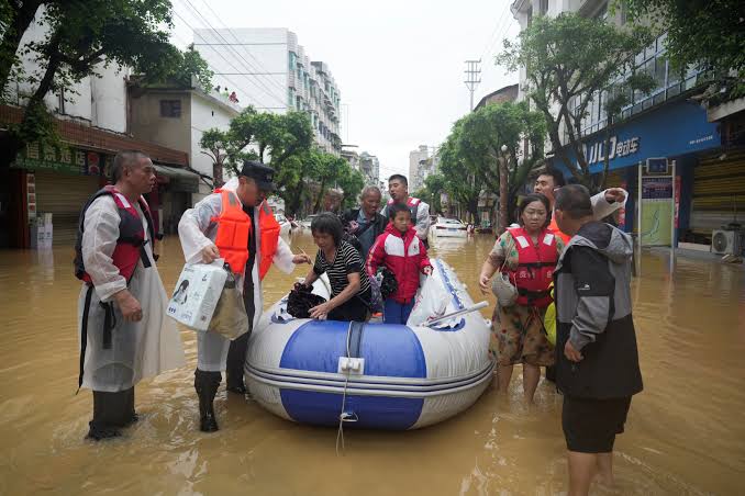 Nearly 20,000 people evacuated after Chinese city gets year's rain in just 24 hours | The Independent