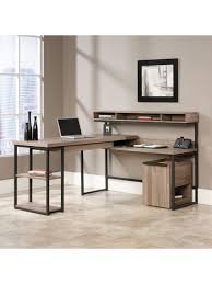 These multi level cart desks are distinguished by their soft ergonomic shapes and are perfectly suited for use as a multi monitor computer desk. Sauder Transit Multi Tiered L Shaped Desk Salted Oak Office Depot