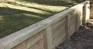 Curved Timber Retaining Wall With Vertical Railway Sleepers Great Timber Retaining Wall Landscaping Retaining Walls Wooden Retaining Wall