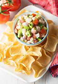 Chop the partially cooked shrimp into small pieces and add to the bowl with the seasoned lime mixture. Ceviche De Pescado Fish Ceviche Recipe A Spicy Perspective