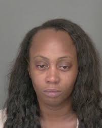 Mack charged in murder of adoptive daughter