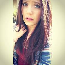 Mahogany red hair makes green eyes pop!