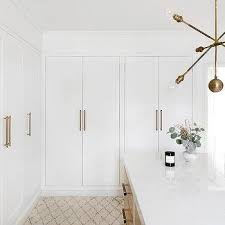 The upper part of your closet (that's difficult to reach) can be used to store items that you don't use quite often. Long Brass Closet Door Handles Design Ideas