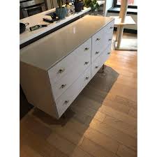 We hoped that for $35 in hardware each we could get our cheaper ikea dressers looking a little classier. West Elm Modernist Wood Lacquer Winter 6 Drawer Dresser Aptdeco