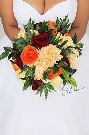 Online flower arrangements offering a wide selection of fresh flowers & roses for the perfect flower delivery. Fall Wedding Flower Brides Bouquet With Orange Dark Red And Ivory Flowers And Lots Of Greenery Red Bouquet Wedding Orange Wedding Flowers Apple Red Wedding