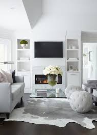 Modern Black And White Rug Living Room White And Gray Modern Living Room Boasts A Dove Gray Sofa Topped With Pink And Black Pillows And P Modern Grey Living Room Living Room Grey Rugs In Living Room