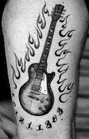 I couldnt decide what exactly i wanted and i didnt want to get a guitar that i would find out i hated in the future, so i designed my own. Pin By Misty On Tattoos Guitar Tattoo Les Paul Guitars Guitar Tattoo Design