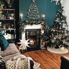 Dark Green Walls Christmas Twig Decoration And Christmas Tree In The Living Ro Christmas Decorations Living Room Christmas Living Rooms Dark Green Living Room