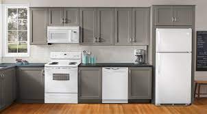 Black appliances blend well with darker finishes of cabinets. I Like This Color Combination White Kitchen Appliances Grey Kitchen Designs Grey Kitchen Cabinets