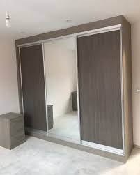 Desk And Sliding Doors Job Finished In Leigh Brown Grey Avola Carcass Inward Tapered Hand Bedroom Design Trends Modern Bedroom Design Minimalist Bedroom Design