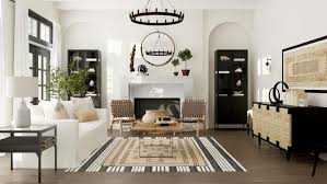 Scandinavian interior design of living room with rattan console, wooden chair, mock up poster frame, pampas in vase and trendy home accessories. 20 Gorgeous Interior Examples Of The Modern Farmhouse Look