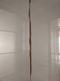 Once you get the epoxy placed and the chip is filled to the right height and profile, you paint the epoxy with a matching paint. How To Repair Chipped Tile Edges On An External Facing Corner Home Improvement Stack Exchange