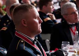 Sgt. Jeremy F. Knudson, Blanchard, N.D., listens to