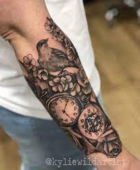 Forearm Tattoo Of Pocket Watch Clock With Roses Cherry Blossoms And Birds In Black And Grey By Kylie Wild Hes Forearm Tattoos Tattoos For Guys Trendy Tattoos