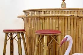 Mid Century Rattan Bamboo Tiki Bar With Stools For Sale At Pamono The unique tiki bar is made of bamboo with a faux leather top and a shelf on the inside for storage. mid century rattan bamboo tiki bar with stools
