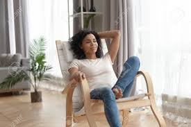 Picket house furnishings wells rocker chair in brown uig3551103e. African Woman In Casual Clothes Leaned On Wooden Rocking Chair Stock Photo Picture And Royalty Free Image Image 137824201