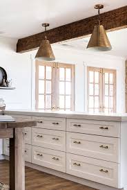 There are a number of styles, and the most popular finishes include chrome, satin nickel, bronze, stainless steel and brass. Classic Brass Drawer Pulls In White Farmhouse Kitchen Boxwoodavenue Com Home Depot Kitchen White Shaker Kitchen Cabinets White Shaker Kitchen