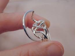 Do not use excessive force in trying to assemble the the rings together as this can damage the shape of each ring. 4piece Puzzle Ring Instructions