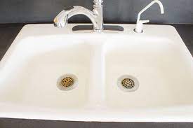 To clean stains on a white kitchen sink. How To Clean An Enameled Cast Iron Kitchen Sink The Inspired Hive