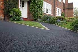 It's a short driveway, maybe 25 feet long, paved with asphalt. Repair Your Asphalt Driveway Yourself Murphree Paving