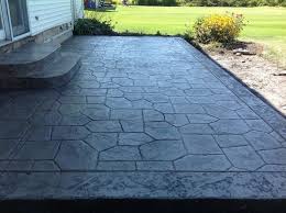 Photos of stamped concrete patios & walkways. Stamped Patio Castle Random Stamp Standard Concrete Charcoal Release With Border Concrete Driveways Stamped Concrete Landscape Construction Retaining Walls Commercial Snow Removal For Buffalo West