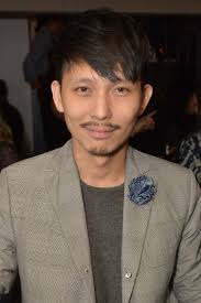 Terry Lu, Editor in Chief of Essential Homme magazine looking dapper in  Fleur'd Pins' large Denim Carnation — FLEUR'D PINS