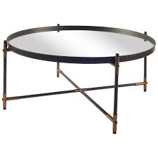 Mirrored finish with metallic silver trim. Brass And Black Round Coffee Table Centuria