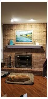 Paint a red brick fireplace a deep shade of matte blue. To Paint Brick Fireplace White Or Not Need Help