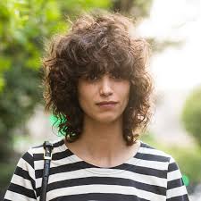 The short black buzz curl Tips For Great Bangs With Curly Hair Allure