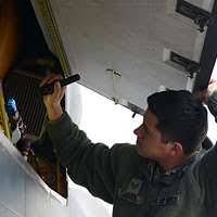SSGT Ralph Singer, Air Force Reservist assigned to the 68th Airlift  Squadron, 433rd Airlift Wing, Kelly Air Force Base, Texas, makes friends by  trading flags and pins with Armenian soldiers