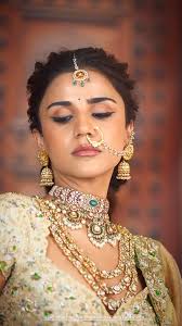 Tissue raw silk lehenga adorned with intricate zardosi mango motifs, paired  with a golden tissue Chanderi dupatta featuring zardosi border work, and a  heavy blouse. Yaksi Deepthi Reddy #indianhandloom ...