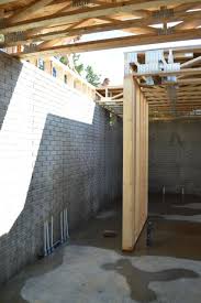 Installing Floor Trusses And Trusses Vs Joists Newlywoodwards Diy Pole Barn Building A House House Foundation