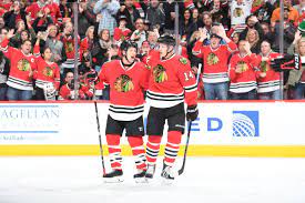 Brian Campbell And Richard Panik Celebrate A Goal Blackahwks Brian Campbell Chicago Blackhawks Blackhawks