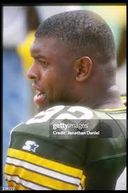 Defensive lineman Reggie White of the Green Bay Packers looks on... News  Photo