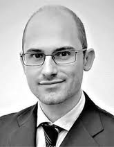 Voltage‐Control of Magnetism in All‐Solid‐State and Solid/Liquid  Magnetoelectric Composites