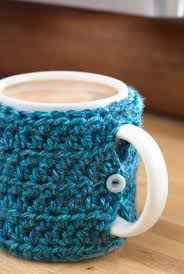 Adorn your coffee mugs with this another great coffee mug cozy that comes with a fantastic texture! One Stitch Mug Cozy At Joann Com Crochet Coffee Cozy Crochet Mug Cozy Crochet Cozy