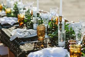 Black tablecloths on boho wedding tables. This Boho Chic Wedding Revolved Around Mud Cloth Green Wedding Shoes