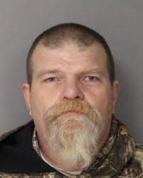 Police: Armed man caught breaking into car outside Newark motel