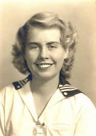 My mom (Ellen Savage) marching with the Bourne High Cheerleaders. I'm  guessing this is the summer of 1953??