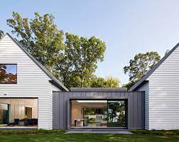 The three bay stone garage was designed to suite the modern day needs of this stately home. Breezeway House Designs
