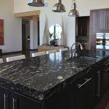 A wooden countertop can make your kitchen stand out with its old world charm. Indian Granite In India Best For Flooring Granite Countertops Kitchen Black Granite Kitchen Kitchen Slab